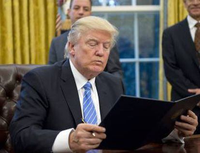 President Donald Trump signing an executive order.