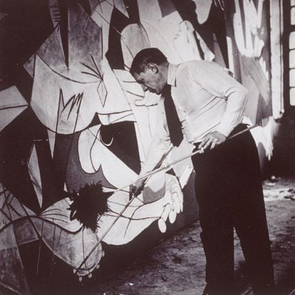 Pablo Picasso painting Guernica in his Paris studio in spring 1937. The photo is by his lover Dore Maar.