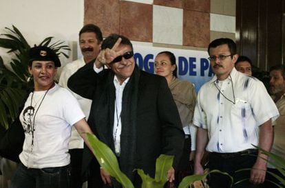 FARC negotiator Jes&uacute;s Santrich gestures as he follows Dutch-born rebel Tanja Nijmeijer on Tuesday. 