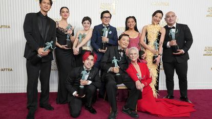 Harry Shum Jr., from back left, Jenny Slate, Tallie Medel, Ke Huy Quan, Stephanie Hsu, Michelle Yeoh, Brian Le, Andy Le, from front left, James Hong, and Jamie Lee Curtis pose with the award for outstanding performance by a cast in a motion pictures for "Everything Everywhere All at Once," in the press room at the 29th annual Screen Actors Guild Awards on Sunday, Feb. 26, 2023, at the Fairmont Century Plaza in Los Angeles.
