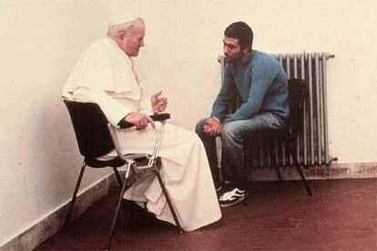 John Paul II visits Turkish assassin Ali Agca in prison in December 1983, two and a half years after Agca made an attempt on his life.