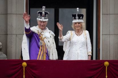 King Charles and Queen Camilla wave from the Buckingham balcony after being crowned last May.