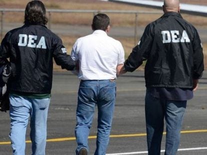 DEA agents arrest a drug suspect.