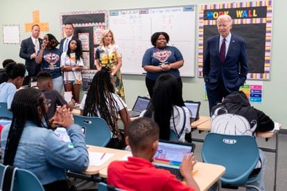 US President Joe Biden (R) speaks to students during a visit alongside first lady Jill Biden (3-R) at Eliot-Hine Middle School in Washington, DC, USA, 28 August 2023.