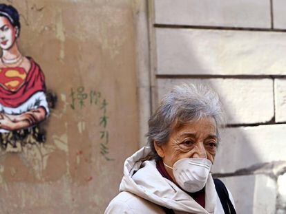 A woman wears a face mask in Rome during the coronavirus crisis.