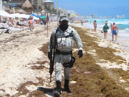 A member of the National Guard on patrol in Playa Ballena, in the Mexican resort of Cancún, on April 4.