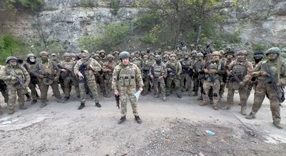 Founder of Wagner private mercenary group Yevgeny Prigozhin makes a statement as he stand next to Wagner fighters in an undisclosed location in the course of Russia-Ukraine conflict, in this still image taken from video released May 5, 2023.