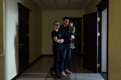  Alona and Denis Makarov, with their son, Leonid, in the hotel.