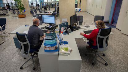 Masked workers at a tax office in Madrid, on July 27.