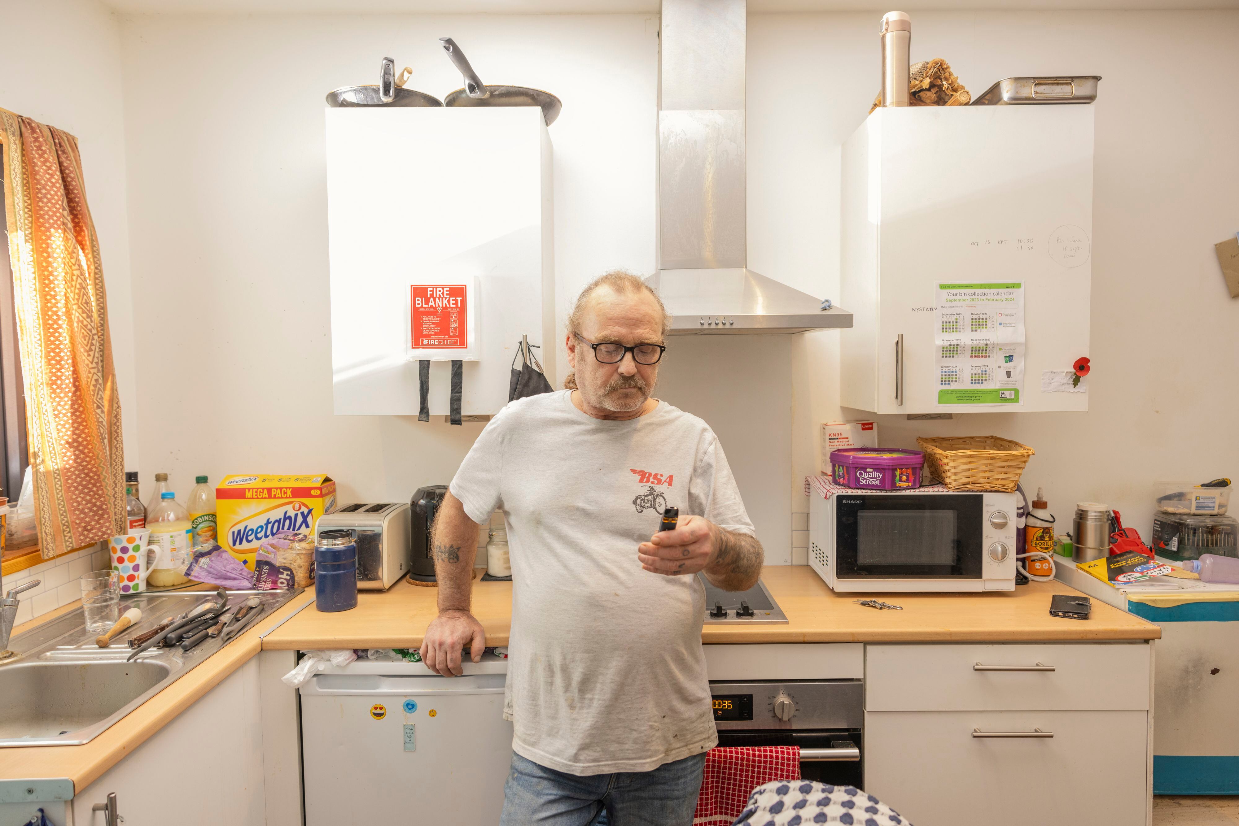 Trevor, one of the tiny home residents, in his kitchen.