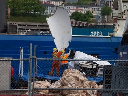Debris from the Titan submersible, recovered from the ocean floor near the wreck of the Titanic, is unloaded from the ship Horizon Arctic at the Canadian Coast Guard pier on June 28, 2023.