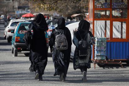 Three female students walking near Kabul University, December 21, 2022.