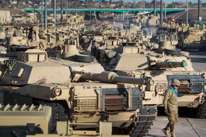 A soldier walks past a line of M1 Abrams tanks, in November 2016, at Fort Carson in Colorado Springs, Colorado.