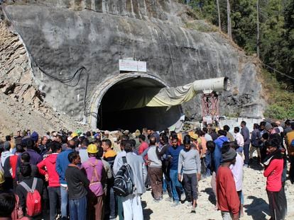 People watch rescue and relief operations at the site of an under-construction road tunnel that collapsed in mountainous Uttarakhand state, India, Wednesday, Nov. 15, 2023.