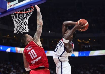 Anthony Edwards of the U.S. in action with Germany's Daniel Theis.