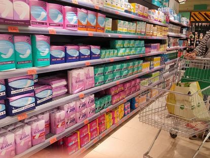 Products related to menstruation and feminine hygiene in a supermarket.