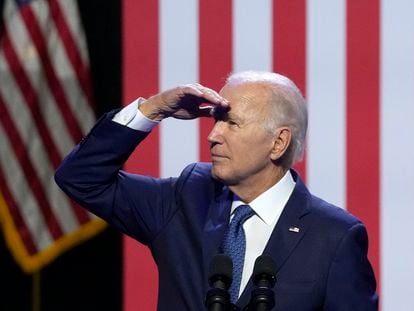 President Joe Biden pauses while speaking about democracy and the legacy of Arizona Republican Sen. John McCain to look up at supporters in the balcony at the Tempe Center for the Arts, Thursday, Sept. 28, 2023, in Tempe, Ariz.