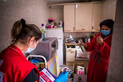 Red Cross volunteers handing out food packages in Alcobendas, in the Madrid region.