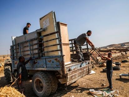 A Palestinian displaced from Khirbet Zanuta moving his belongings on November 1.