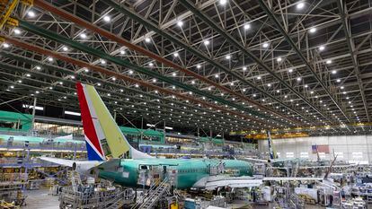 FBoeing employees work on the 737 MAX at Boeing's Renton plant in June 2022.