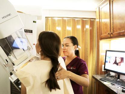 A woman gets a mammogram in Brownsville, Texas, on September 18, 2017, inside a Mammos on the Move (MOM) mobile mammogram trailer.