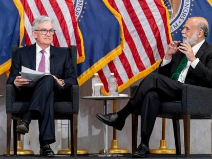 Former Federal Reserve Chairman Ben Bernanke, right, accompanied by Federal Reserve Chairman Jerome Powell, left, speaks during the Thomas Laubach Research Conference at the William McChesney Martin Jr. Federal Reserve Board Building in Washington, Friday, May 19, 2023.