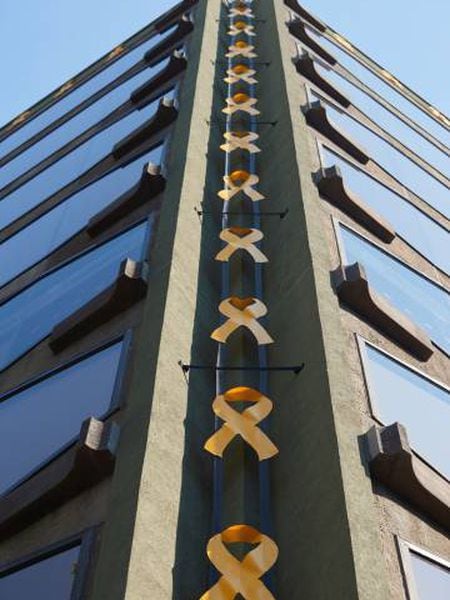 Yellow ribbons adorn a building in Barcelona.