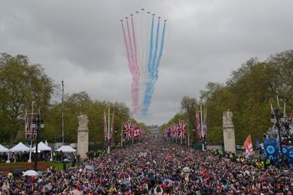 Royal Air Force jets fly over crowds on the way to Buckingham Palace after the coronation ceremony.