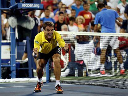 Tommy Robredo celebrates his straight sets victory over Roger Federer on Monday. 