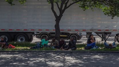 Migrants rest on a median in front of the Northern Bus Station in Mexico City, on September 22, 2023.