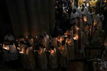 Priests participate in the Easter Sunday Mass led by the Latin Patriarch of Jerusalem Pierbattista Pizzaballa