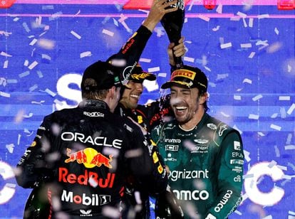 Aston Martin's Fernando Alonso celebrates on the podium after finishing third place in the Saudi Arabian Grand Prix with winner Red Bull's Sergio Perez and second placed Red Bull's Max Verstappen.