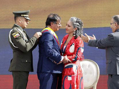 President Gustavo Petro receives the presidential sash from Senator María José Pizarro and from President of the Senate Roy Barreras, during his inauguration in the Plaza Bolívar, in Bogotá, on August 7, 2022.