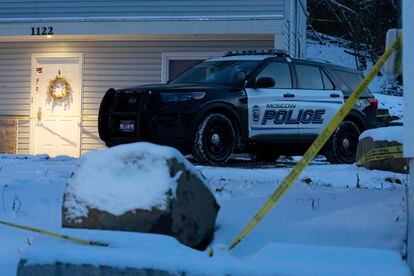 Local police guard the house in Moscow, Idaho, where the four students were found on November 13.