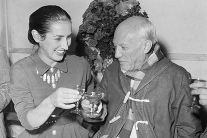 Pablo Picasso, famed Spanish painter, born at Malaga on Oct. 25, 1881, clinks glasses with his wife, Francoise Guillot