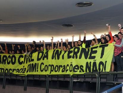 A group of activists celebrates the passing of Brazil's new internet law on Tuesday.