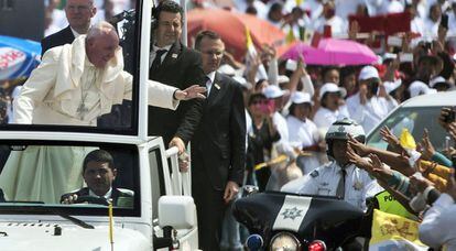 The pope waves to a crowd in Ecatepec on Sunday.