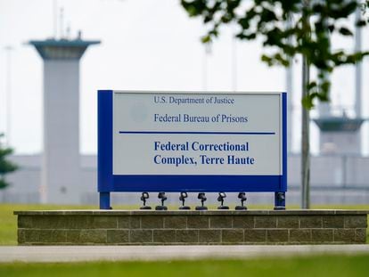 A sign is displayed at the federal prison complex in Terre Haute, Ind., on Aug. 28, 2020.