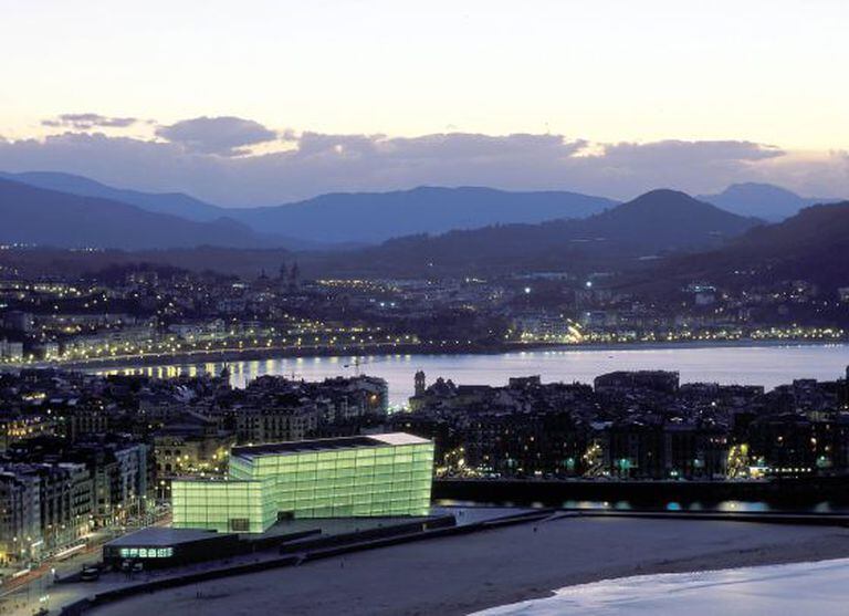 A view of Moneo's Kursaal center, lit up by the beach in San Sebastián.