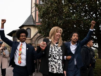 From left, expelled Rep. Justin Pearson, Rep. Gloria Johnson, and expelled Rep. Justin Jones raise their fists as they walk across Fisk University campus on April 7, 2023, in Nashville, Tennessee.