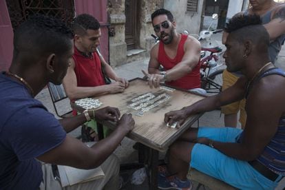 A group of Cubans playing domino on a Havana street.