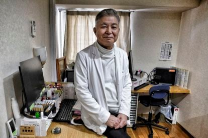 Dr. Haruhiko Dozono, 71, at the Dozono Medical House clinic in front of the Nagaya Tower building, which he designed.