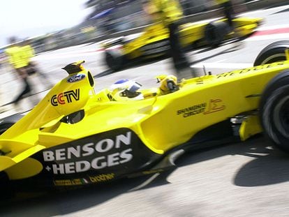 In this file photo taken on May 2, 2003, Italian Jordan-Ford driver Giancarlo Fisichella steers his car in the pits of the Montmelo racetrack near Barcelona before the Catalunya Formula One Grand Prix of Spain.
