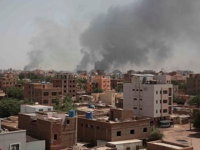 Smoke rises from a central neighborhood of Khartoum, Sudan, on April 16, 2023, after dozens have been killed in two days of intense fighting.