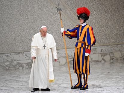 Pope Francis passes by a member of the Pontifical Swiss Guard, on Wednesday.
