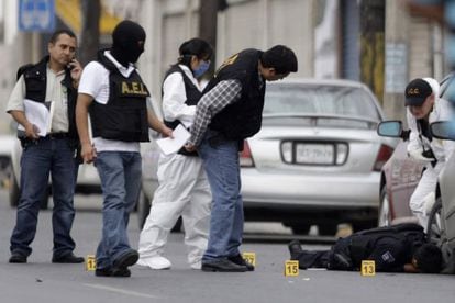Police in Monterrey try to reconstruct a recent crime scene.