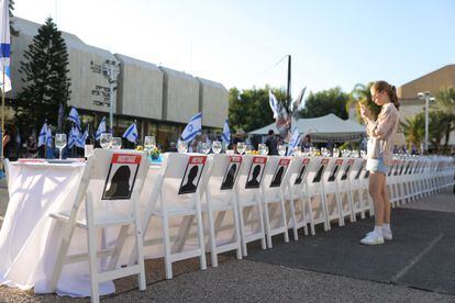 Artistic installation of a Sabbath dinner table with an empty chair for each abductee in Gaza, on Saturday in Tel Aviv.
