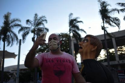 A Bolsonaro supporter takes a selfie with an effigy of the president at the Maracanã Stadium in Rio de Janeiro.