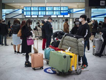 Passengers arrive in France from Beijing.