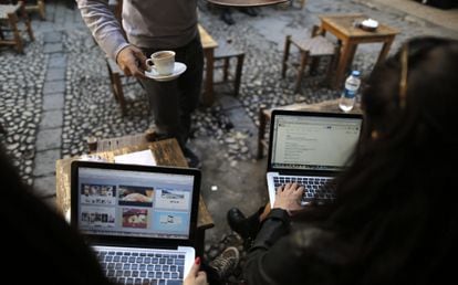 Two women try to connect to Twitter in a cafe in Istanbul in March 2014.